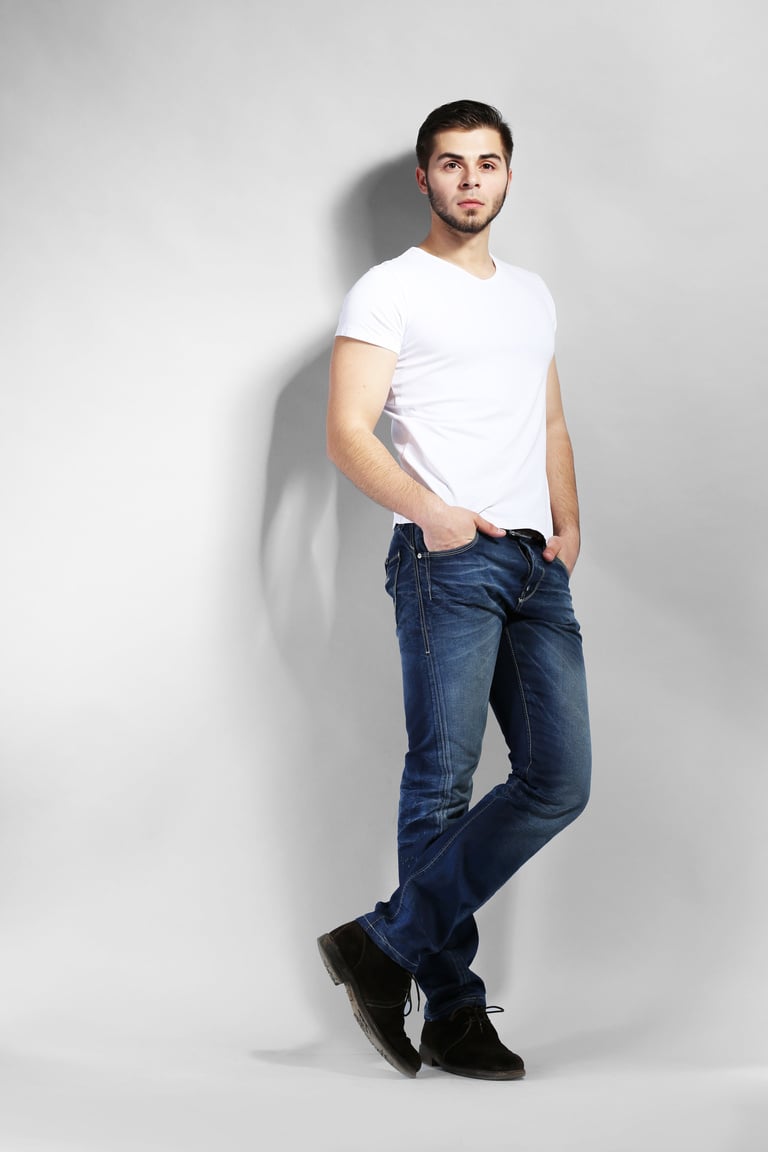 Male Model in Jeans Posing on Gray Background